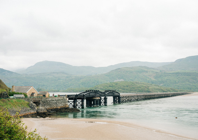 Family walk across Barmouth Bridge, North Wales